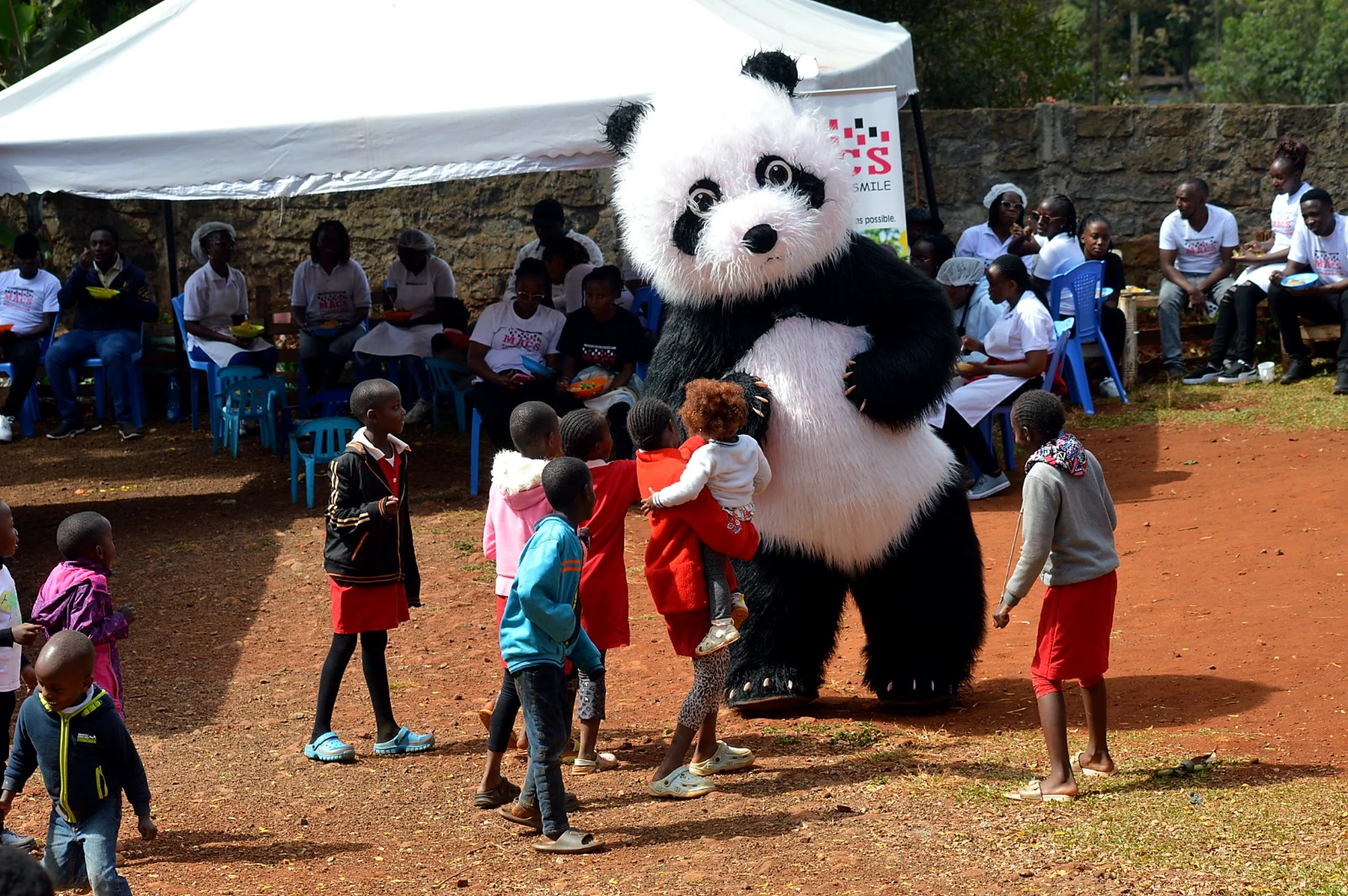 Community volunteers supporting a child